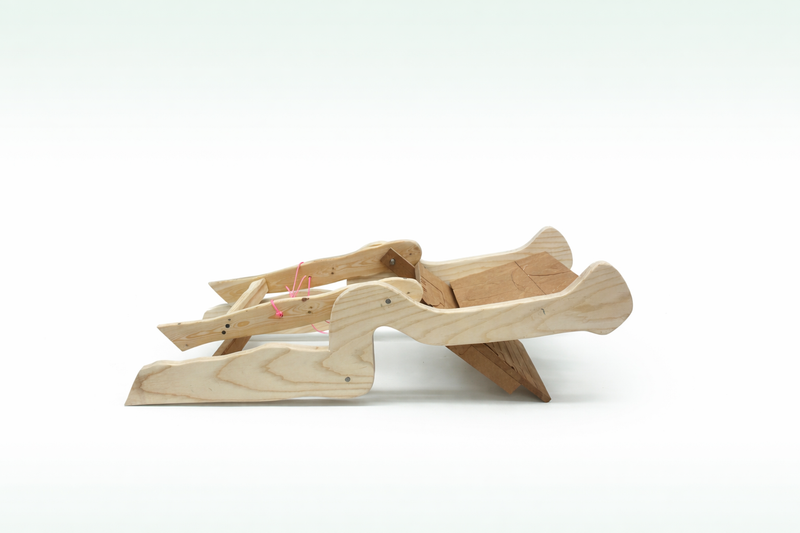 Hand opening the chair's folding mechanism
